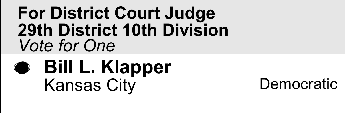A political campaign sign for District Court Judge, 29th District, 10th Division, featuring candidate Bill L. Klapper from Kansas City, supporting voting for him, with his name bolded and a black circle with a white star symbol next to his name.