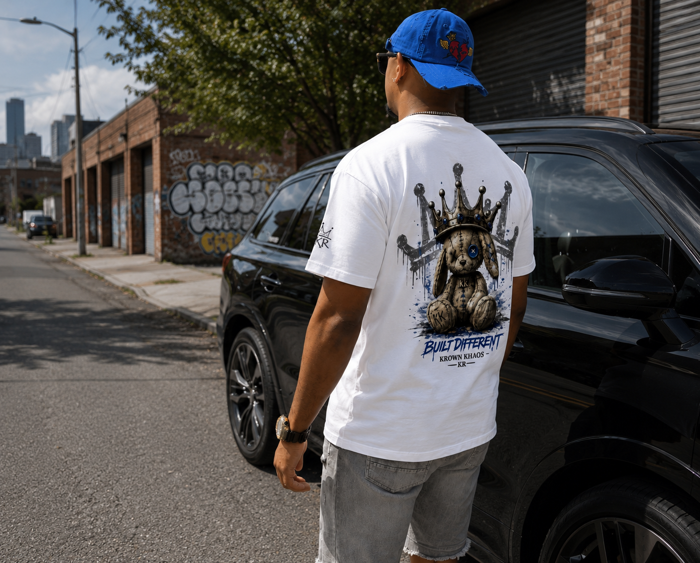 Krown Khaos Built Different men's graphic t-shirt featuring crowned teddy bear artwork, premium streetwear in white