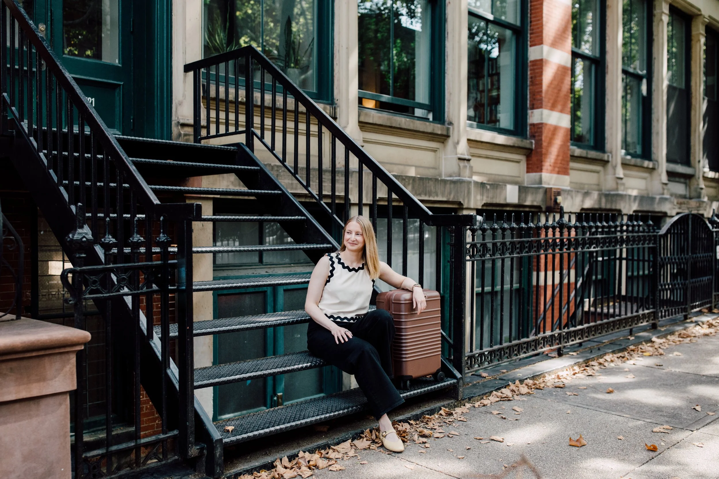 Elyse with suitcase in NYC