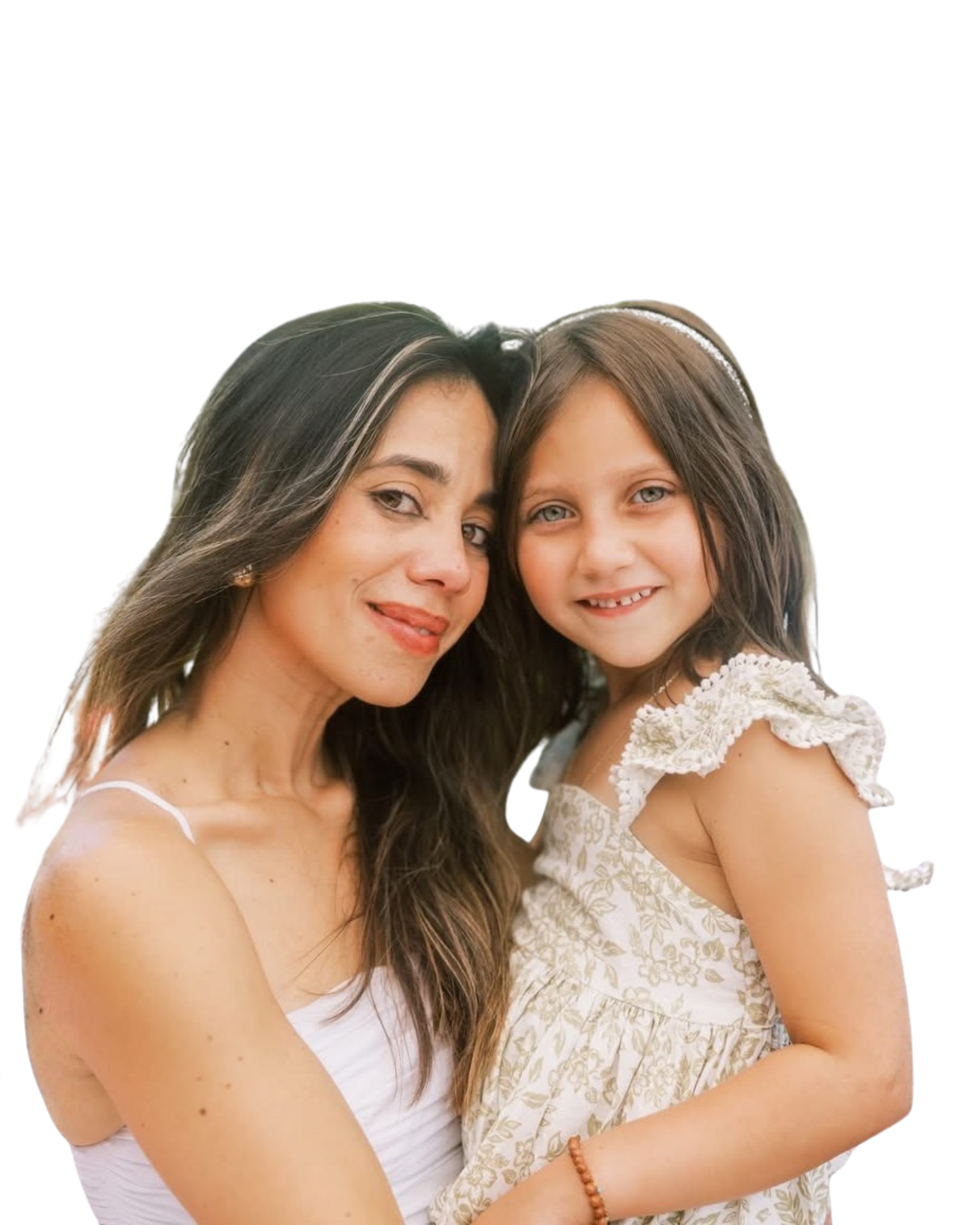 A woman with long brown hair and a girl with medium-length brown hair and blue eyes smiling and hugging each other.