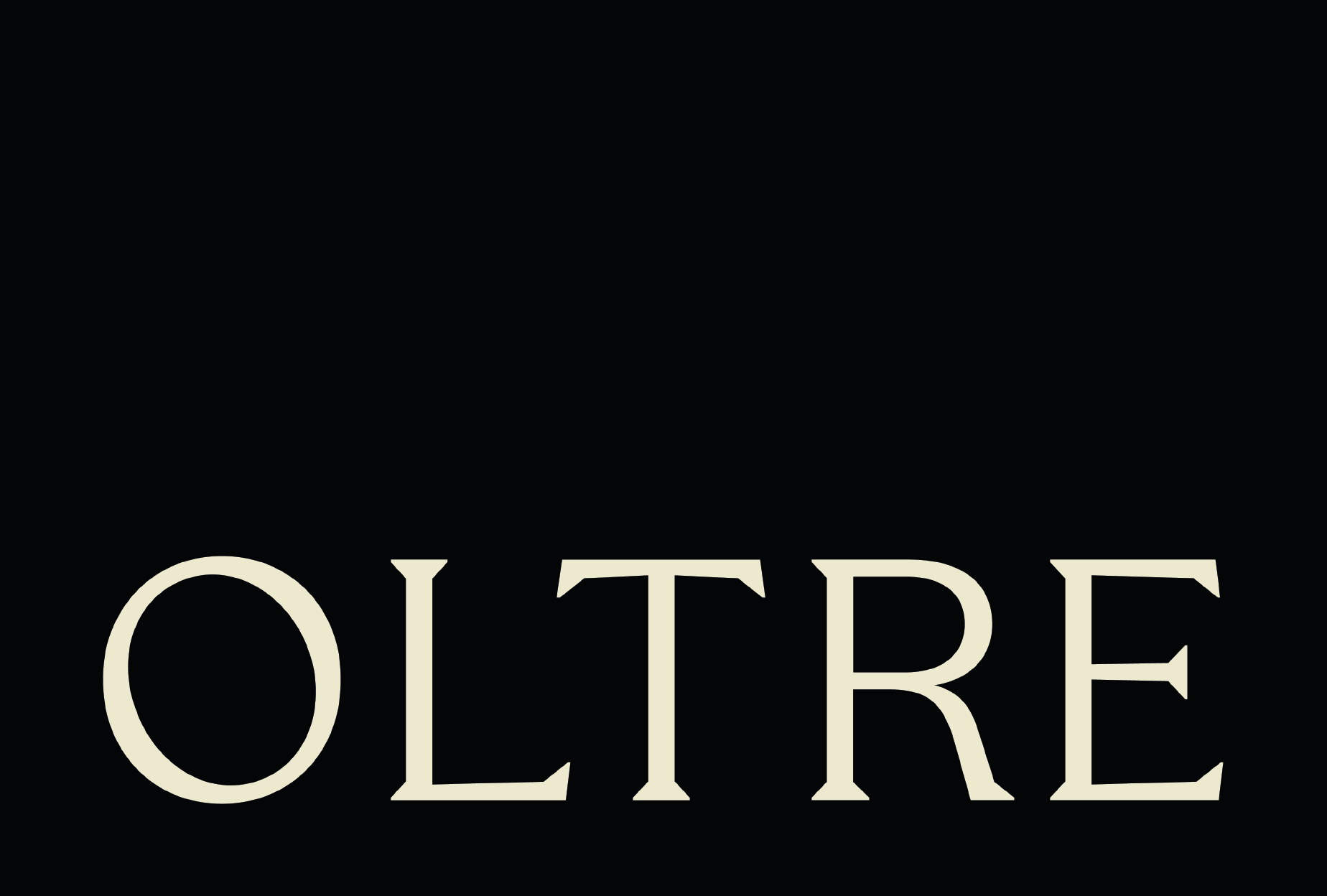 Close-up of the word 'QUILTER' in large, beige letters on a black background.