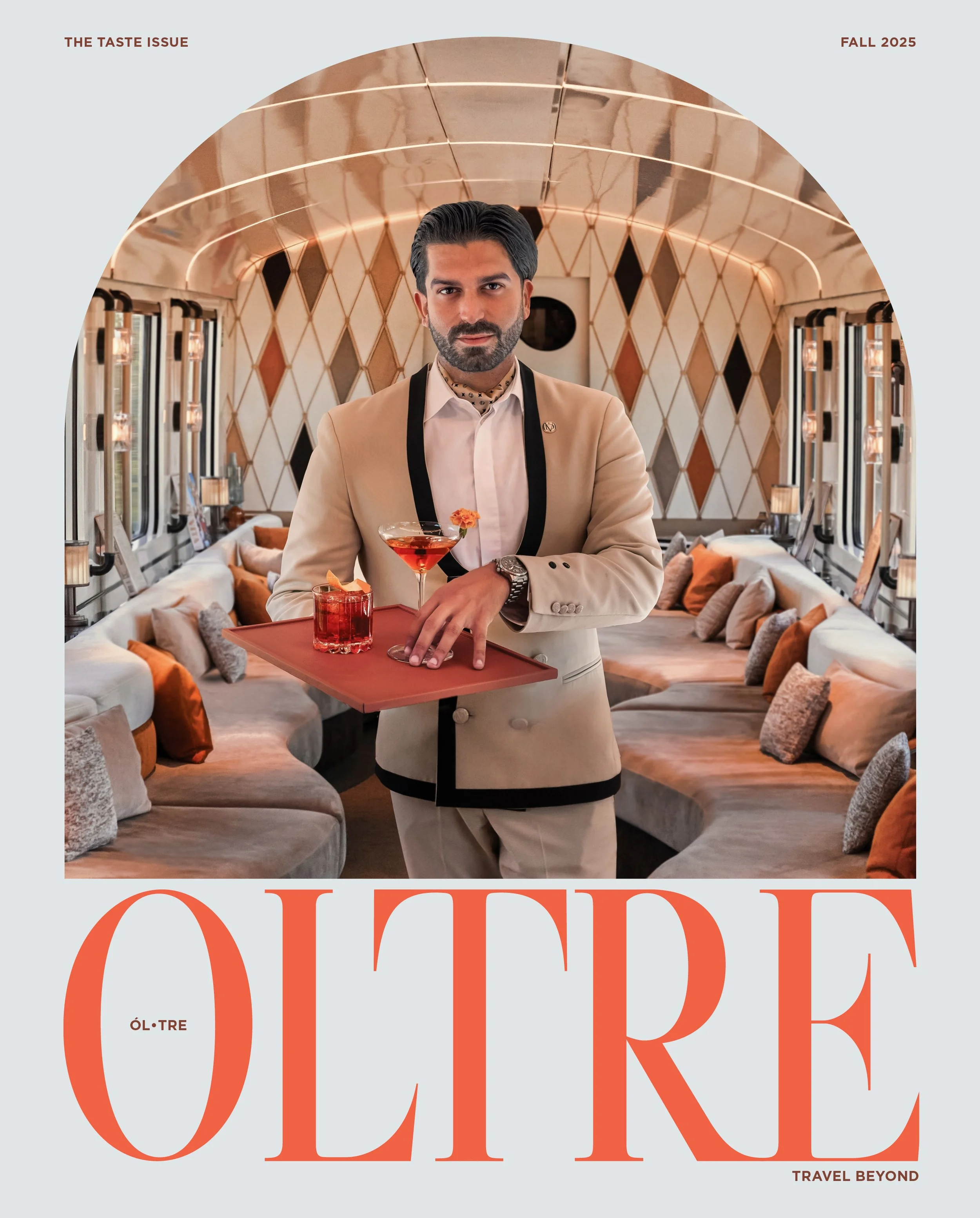 Cover of a magazine titled 'ODesk,' featuring a man with dark hair and beard wearing a cream-colored blazer, holding a cocktail, in a luxurious lounge with curved seating and patterned walls.