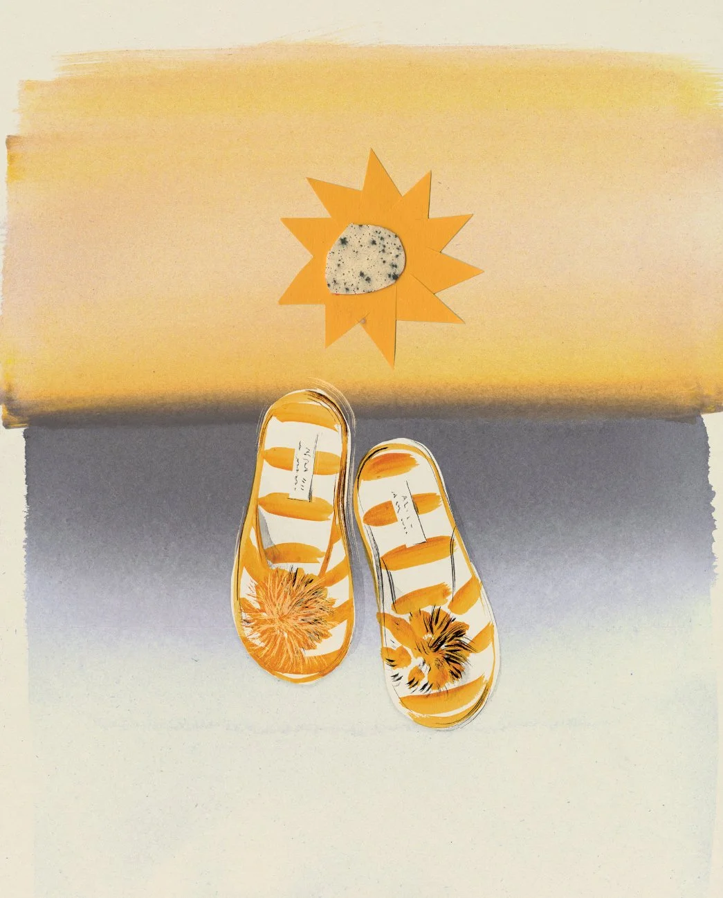 Yellow and white striped slippers with a flower design on the toes, placed on a light-colored surface. There is a paper sun craft and a textured stone in the background.
