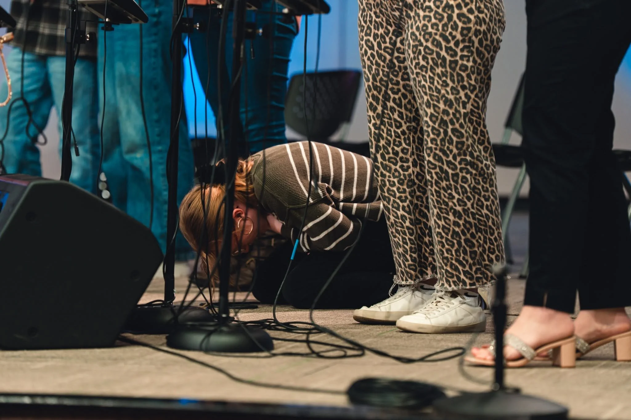 JSBC worship team member praying