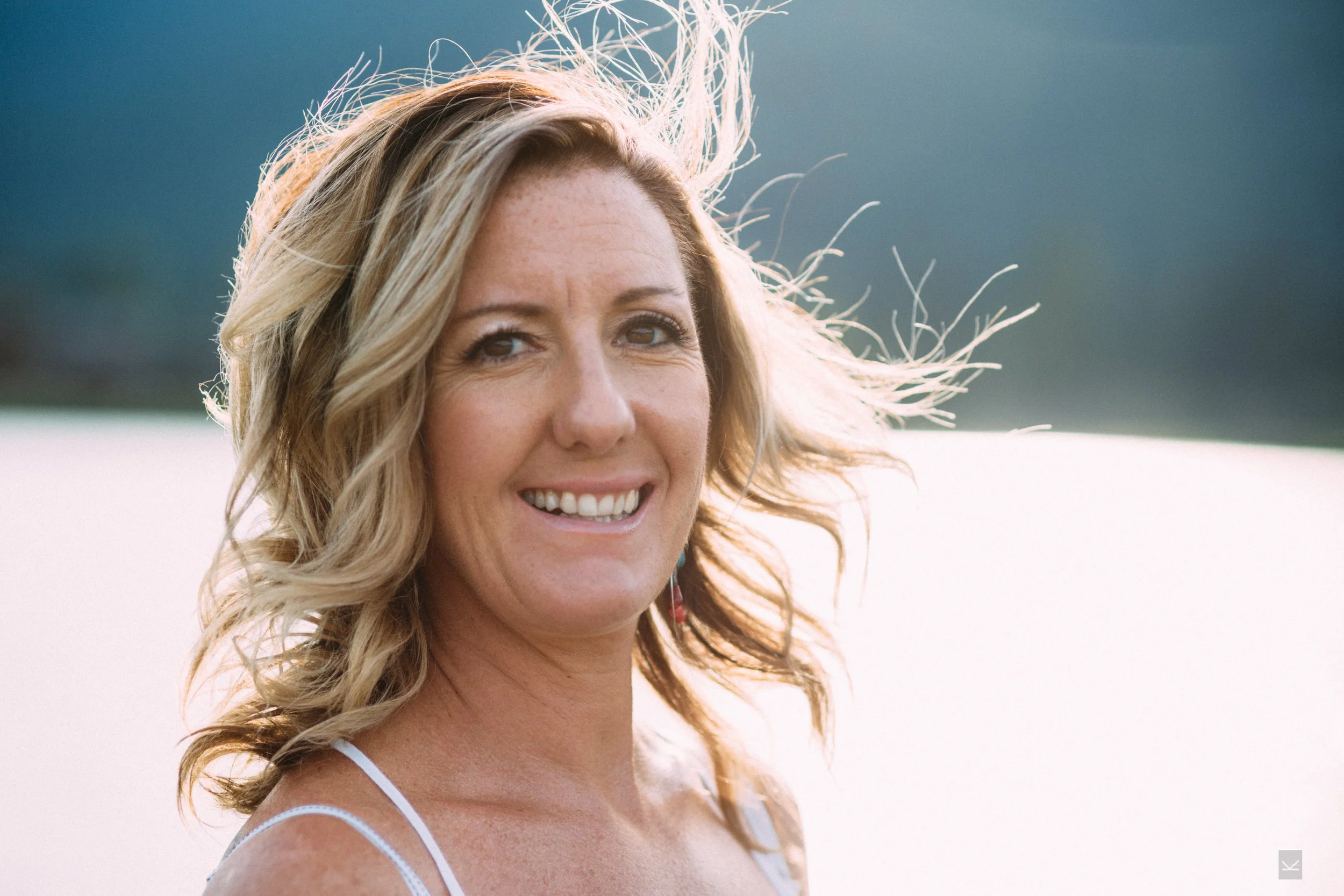 Professional portrait of Marjie Martini, The Menopause Strategist, providing elite hormone coaching and luxury midlife wellness consulting for high-achieving women.
