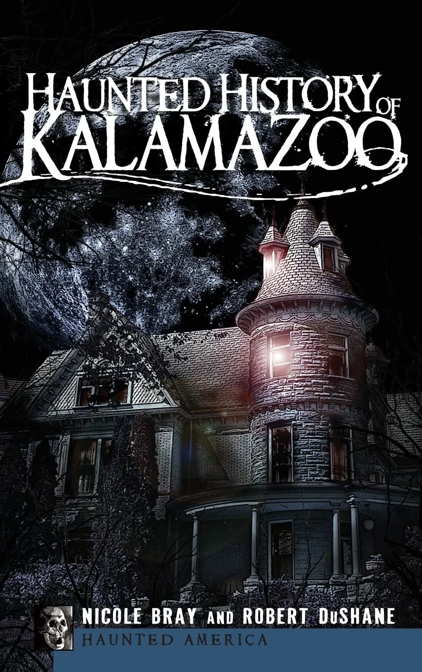 Book cover titled 'Haunted History of Kalamazoo' featuring a haunted house at night with a large moon and dark trees in the background.