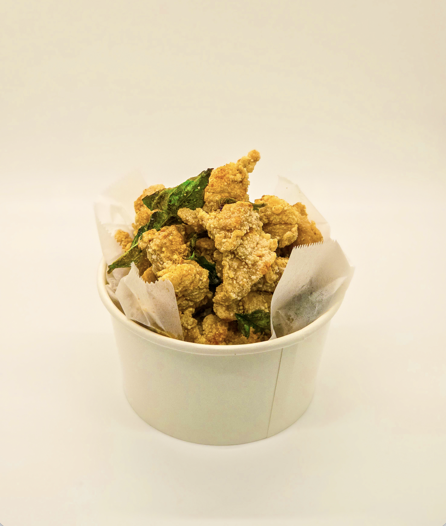 Halal Taiwanese Popcorn Chicken snack with fresh basil at Bingsu Tea, North Natomas Sacramento.