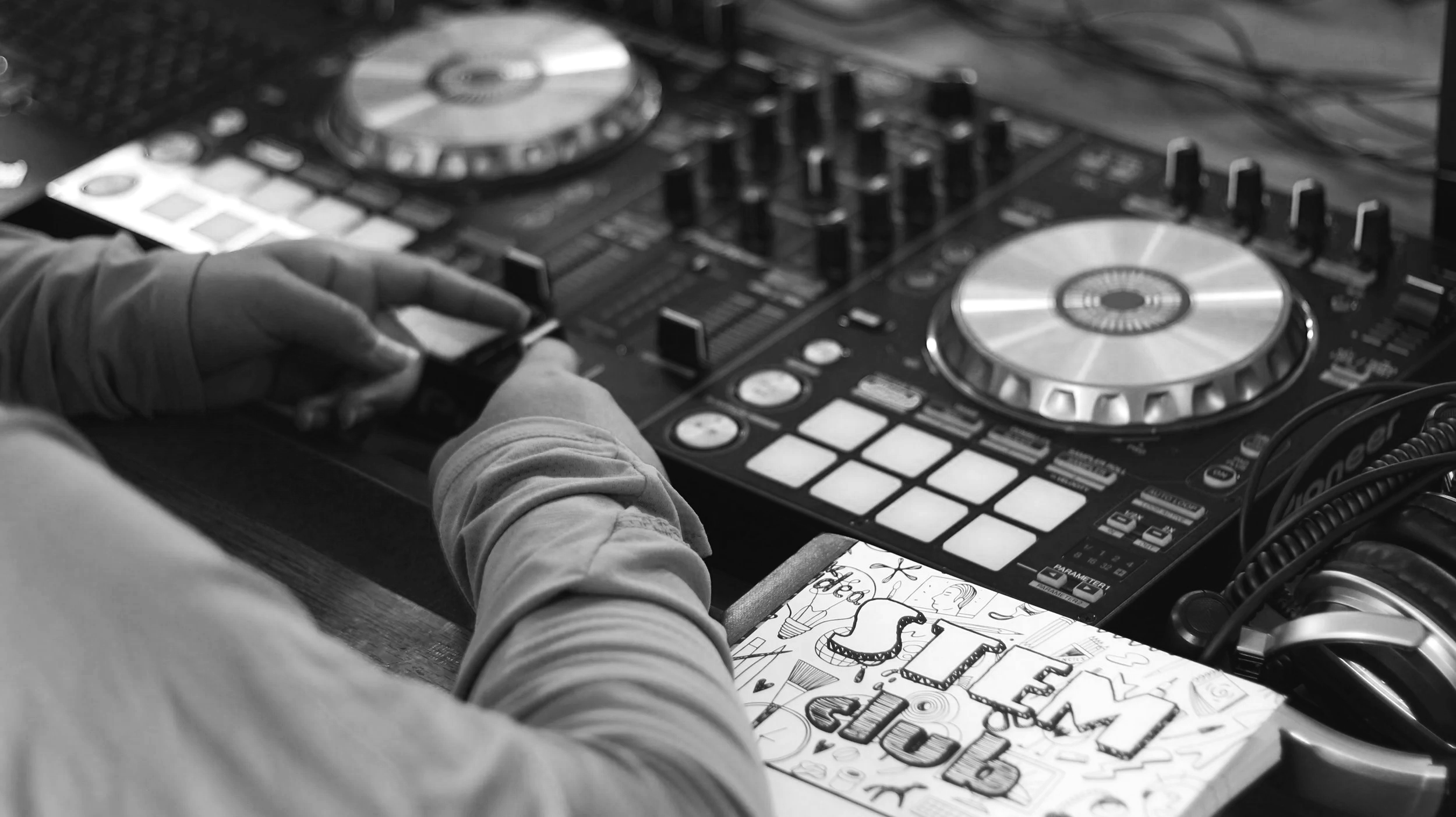 Student using DJ equipment during an AM Project youth music and creative technology program in San Antonio.