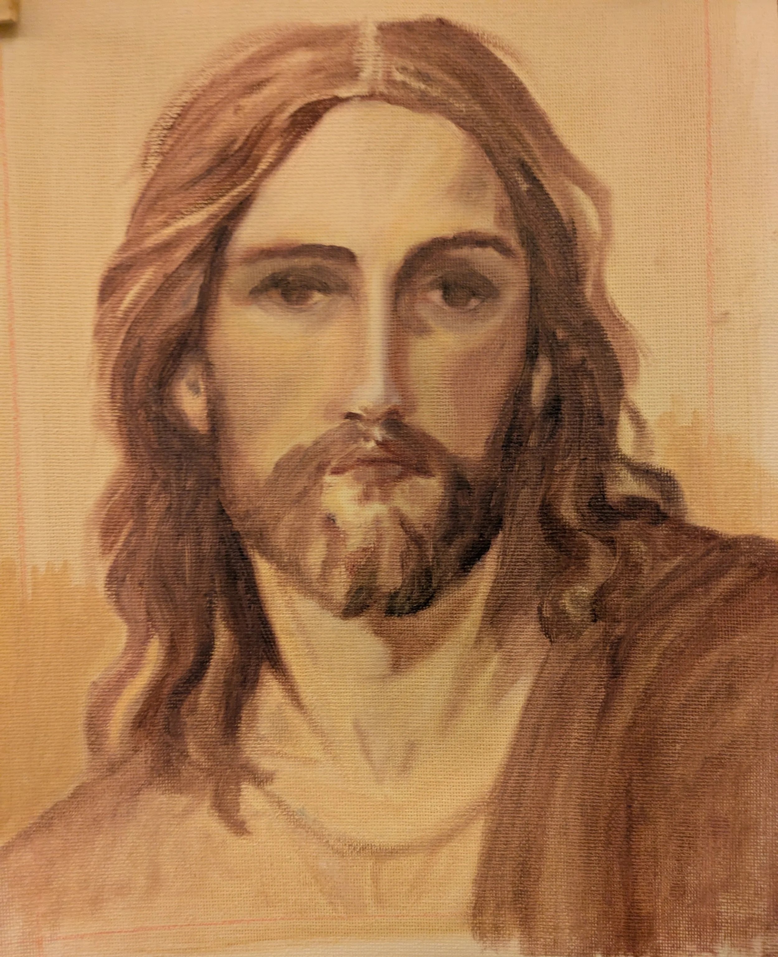 Close-up of a painted image of Jesus Christ with long hair, a beard, and a solemn expression with burnt umber colors.