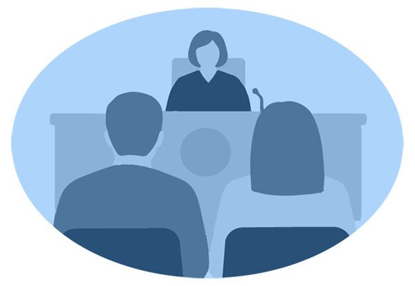 Illustration of a defendant and their lawyer seated together, viewed from behind, facing a judge at the bench in a courtroom.