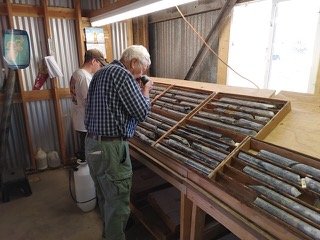 George Cole, US Copper Director and technical team, holding block 553' and Justin Caliborne, Project Geologist and Site MAnager; reviewing core from the July 14, 2021 drilling on the Superior deposit from hole S21-7, block 553'