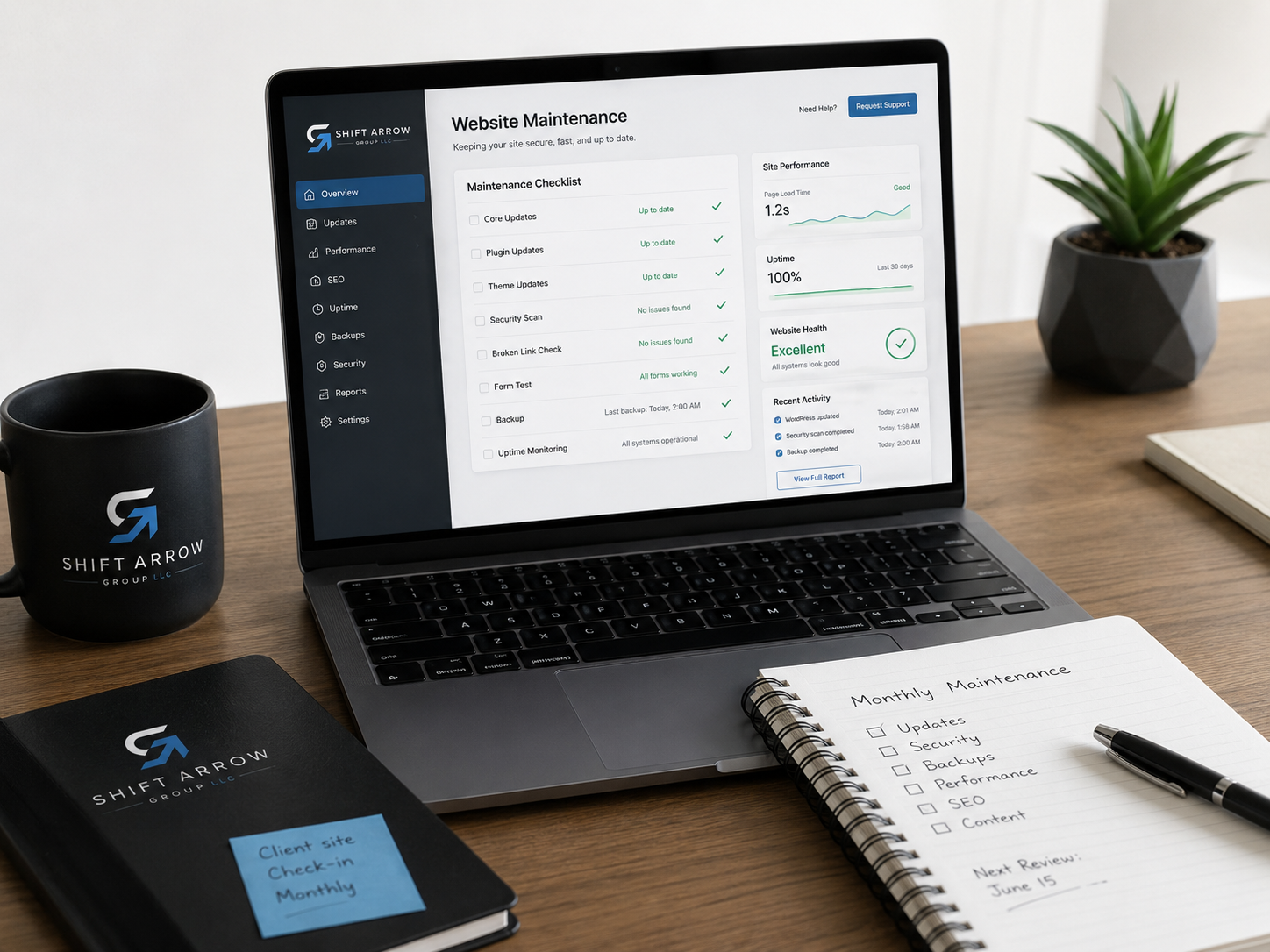 Website maintenance dashboard on a laptop with a client site checklist and monthly support notes.