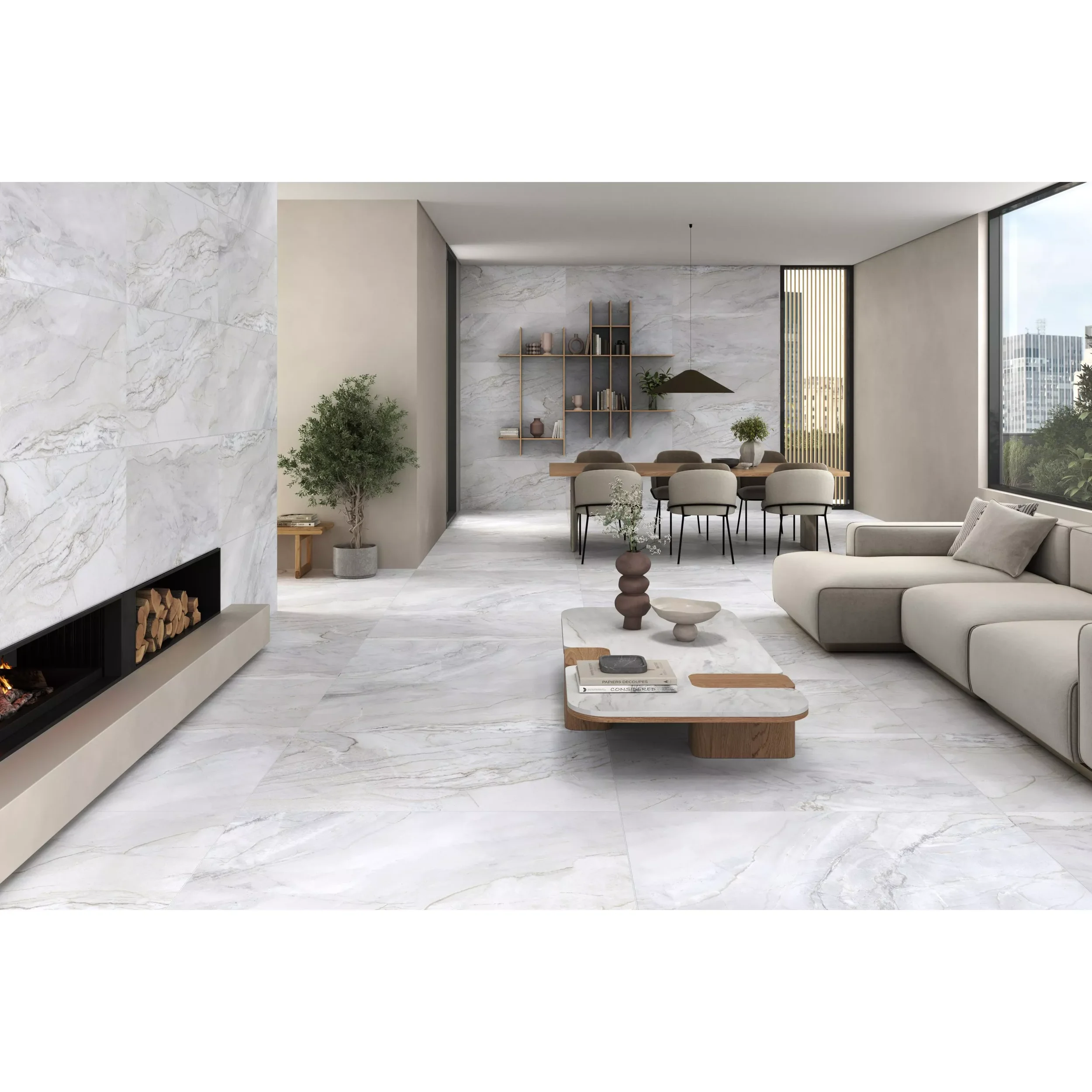 Modern living room with marble walls and floors, large windows, a beige sofa, coffee table with books, and minimalistic decor including plants, shelves, and a large pendant lamp.