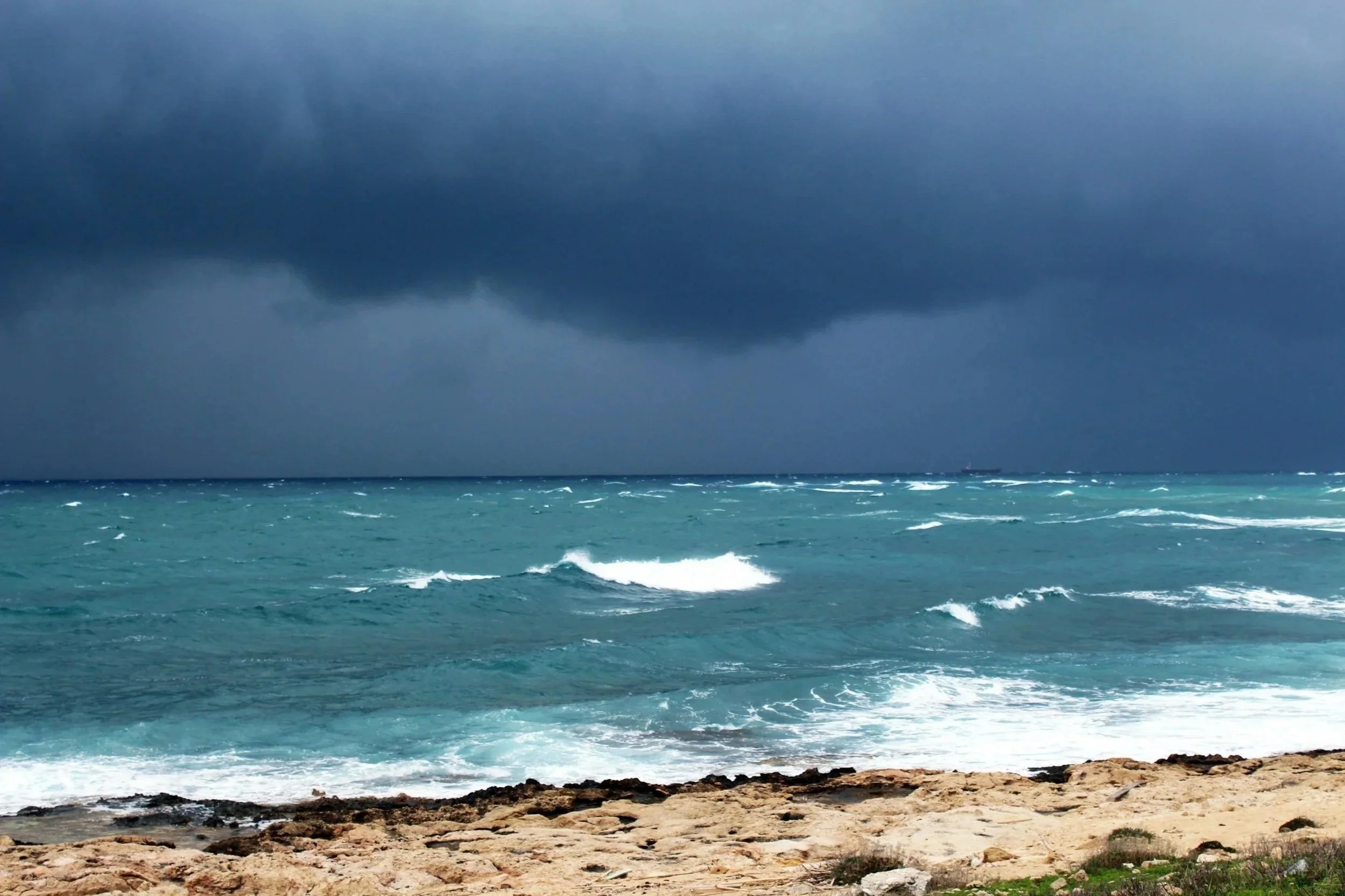 storm coming on the horizon of a beach scene