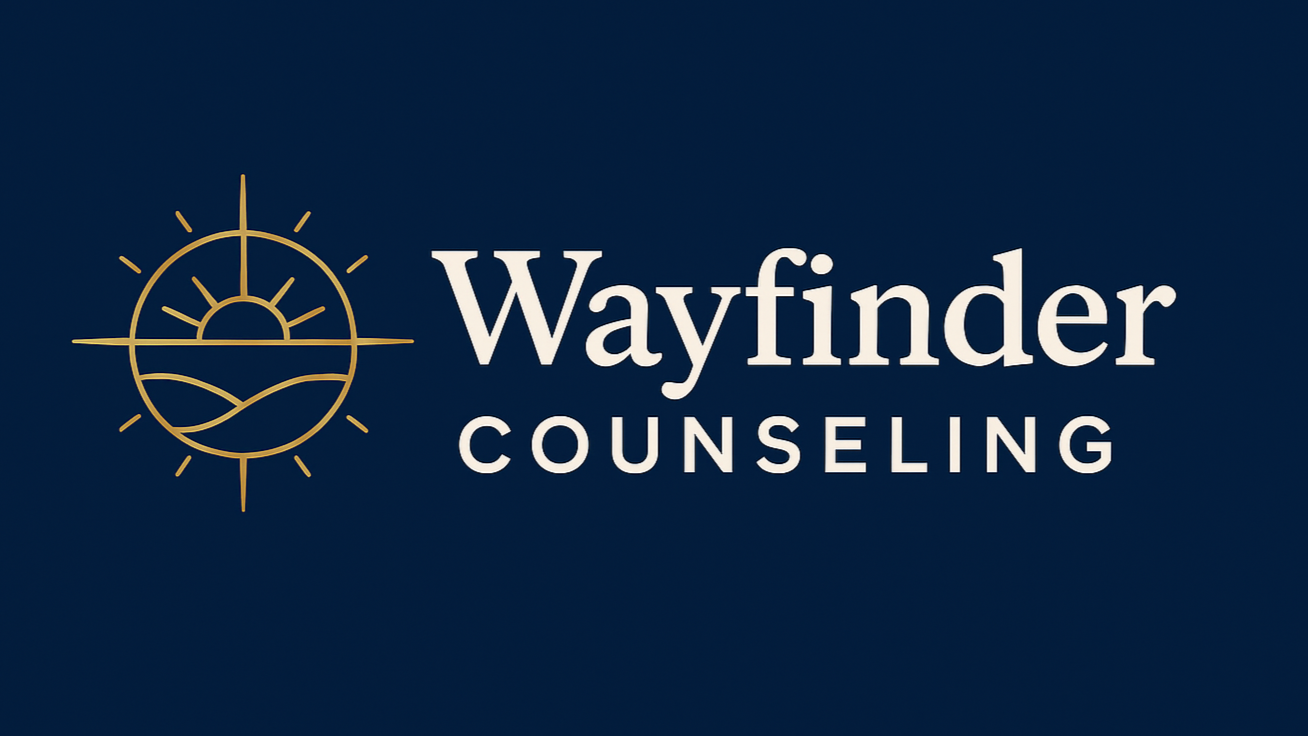 Wayfinder counseling logo navy background with gold compass with a sun in it and mountains in it and cream lettering