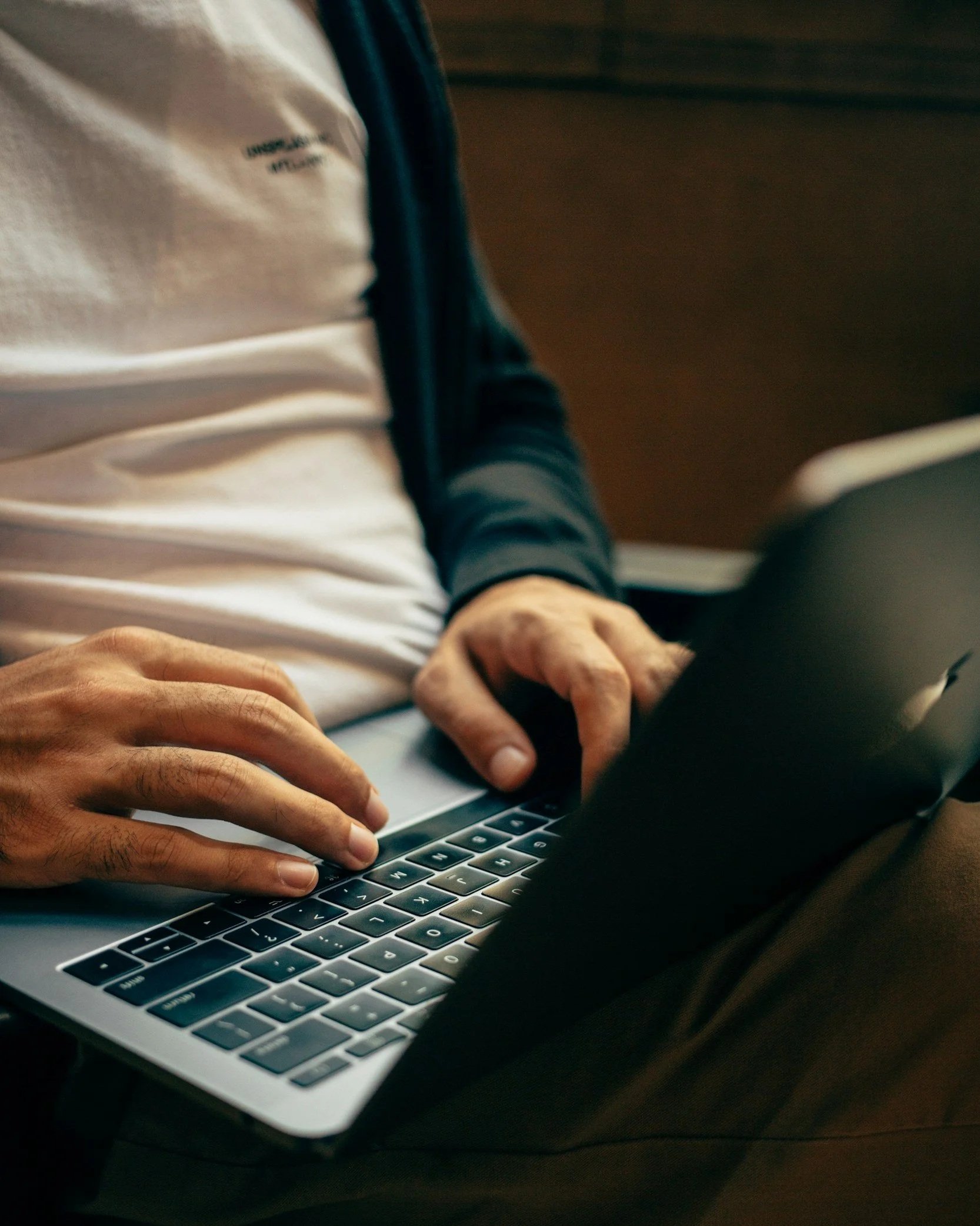 man with a laptop typing