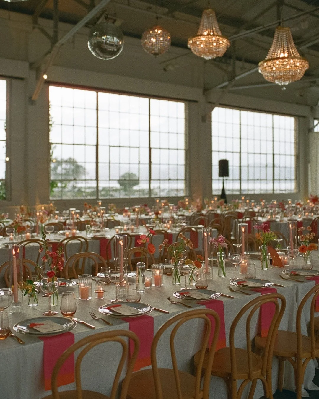 Pink, orange, candlelight &amp; a little disco overhead 🪩⁠ A tablescape that felt playful, romantic and even better once the sun went down.⁠
⁠
Planning @eventsbygs ⁠
Photography @angelajazmin.studio 
Florals @violetandaster 
Catering / Bar @kitcheni