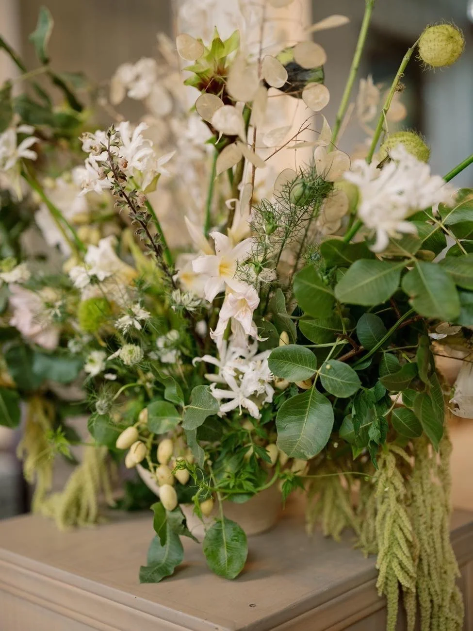 White and green wedding floral arrangement designed by Events by GS.