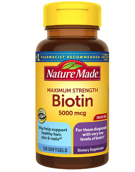 Bottle of Nature Made Biotin 5000 mcg dietary supplement with yellow cap and yellow label.