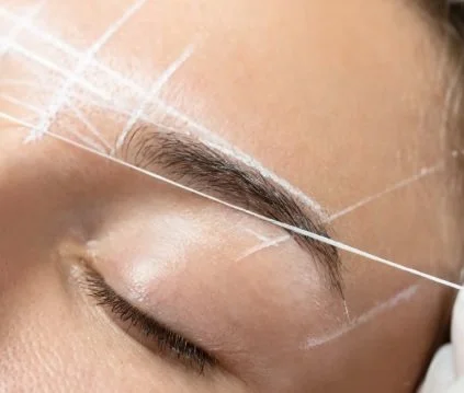 Marks showing the ideal shape or an eyebrow