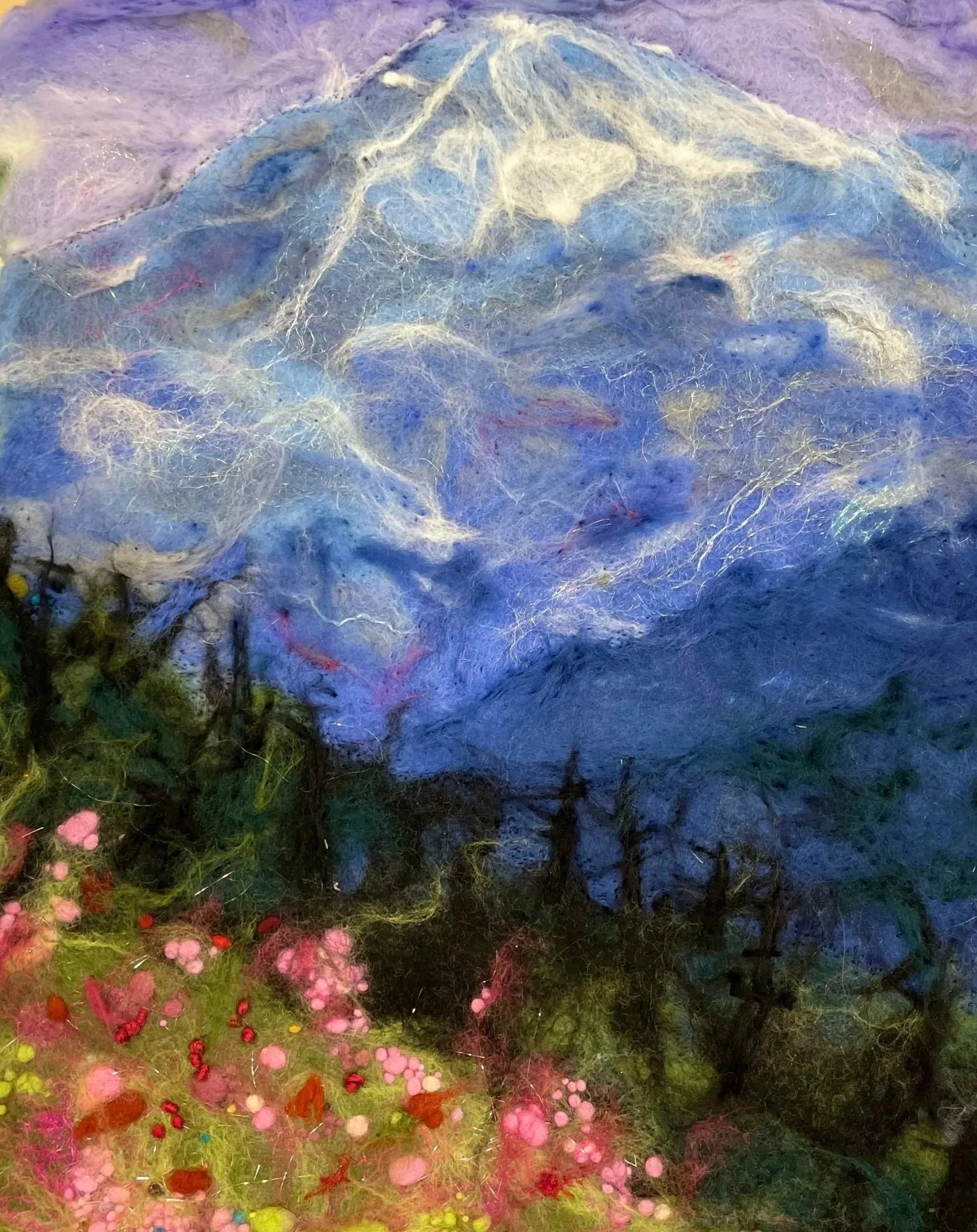 Colorful abstract painting of a mountain landscape with a purple and blue sky, green grass, and pink flowers in the foreground.