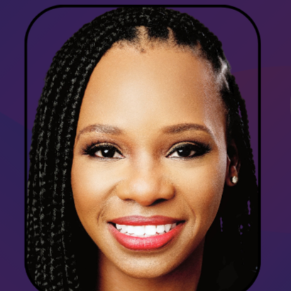 Close-up of a smiling woman with braids and makeup against a purple background.