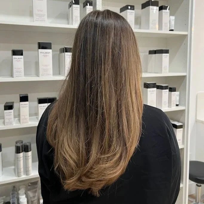 Chicago woman with bronde hair with seamless, natural highlights on brunette base