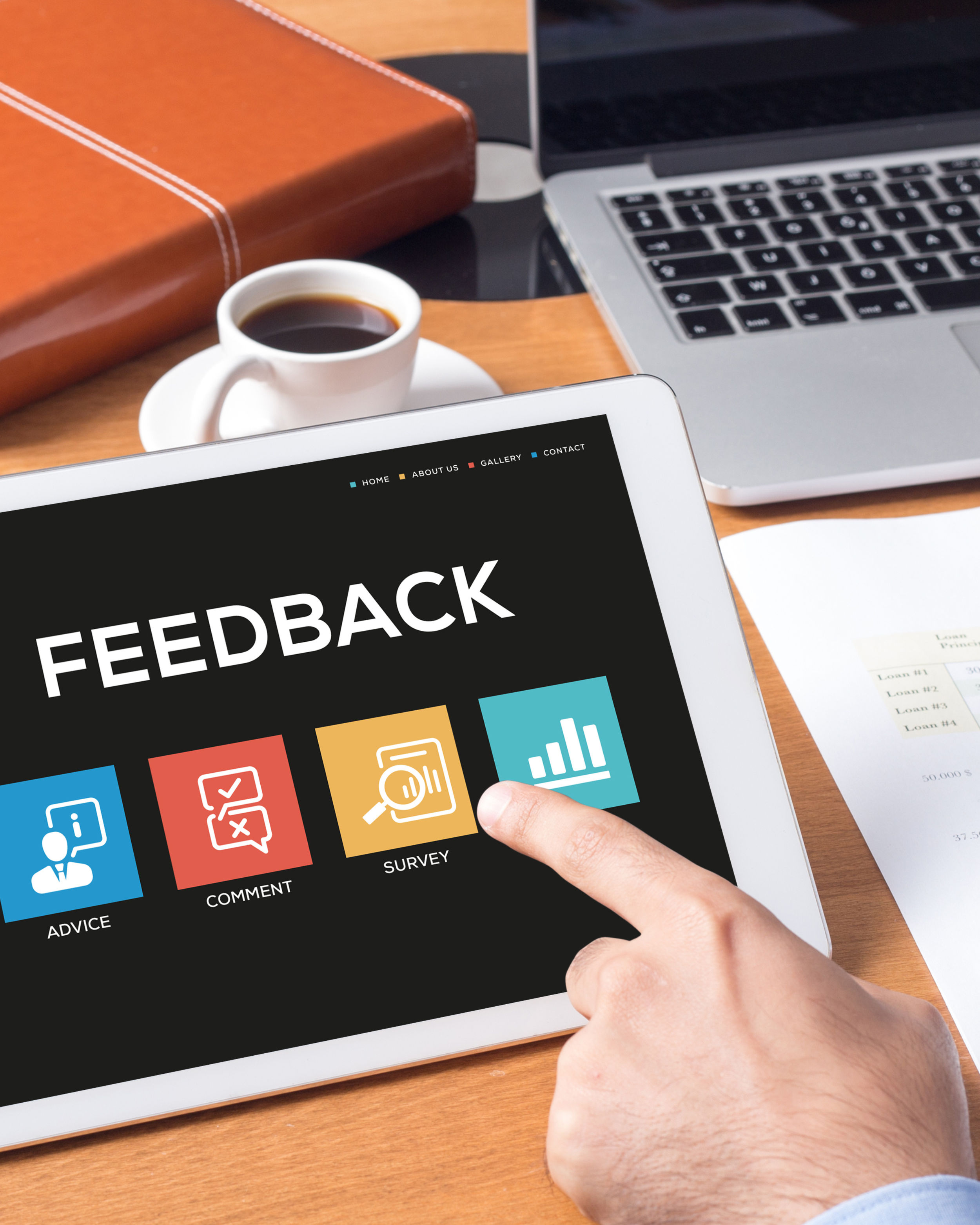 Person using touchscreen device displaying feedback survey with icons for advice, comment, survey, and rating.