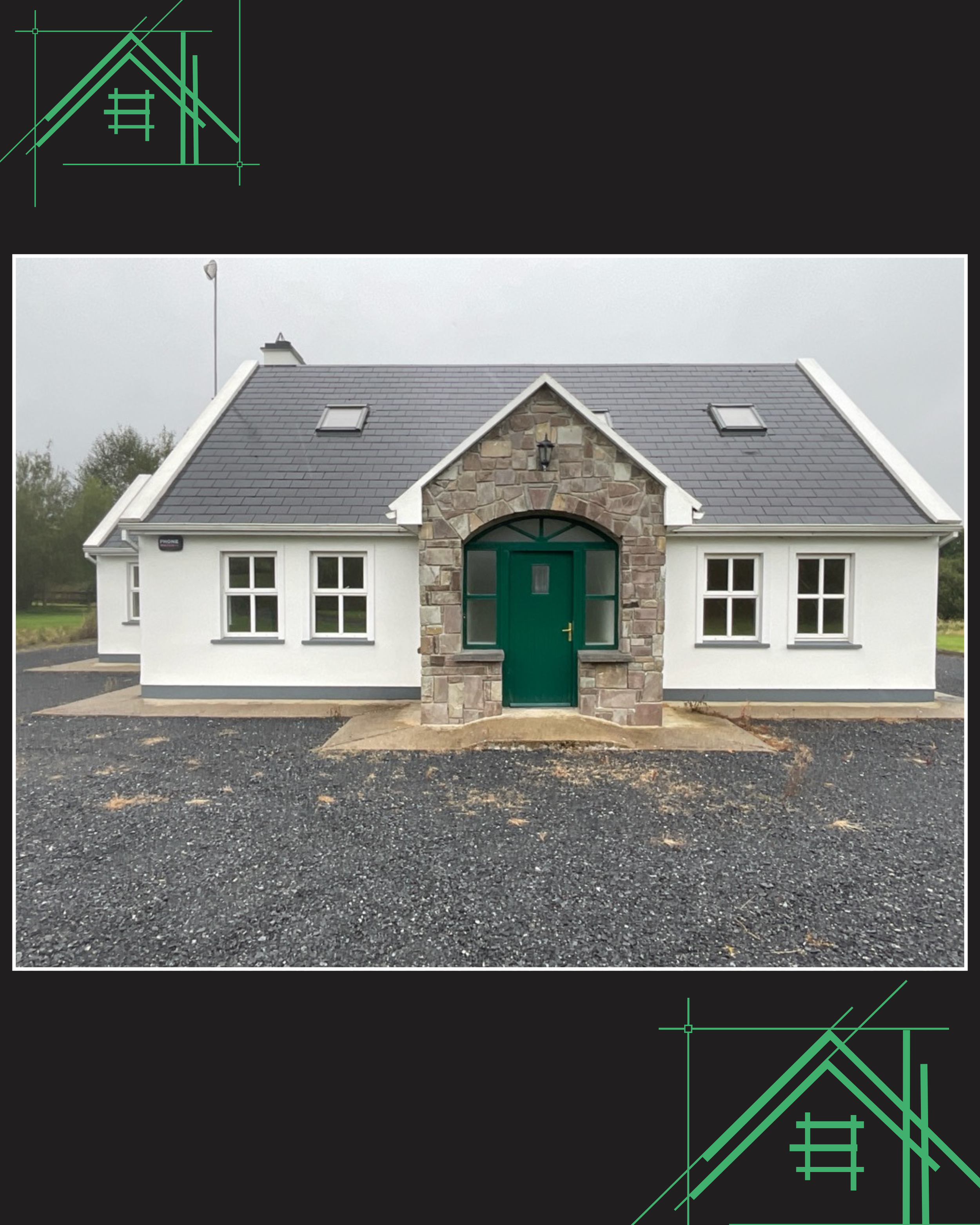 Front view of a house with a stone facade and a green door, pitched roof with skylights, and a garage, set on a driveway, with an overcast sky.