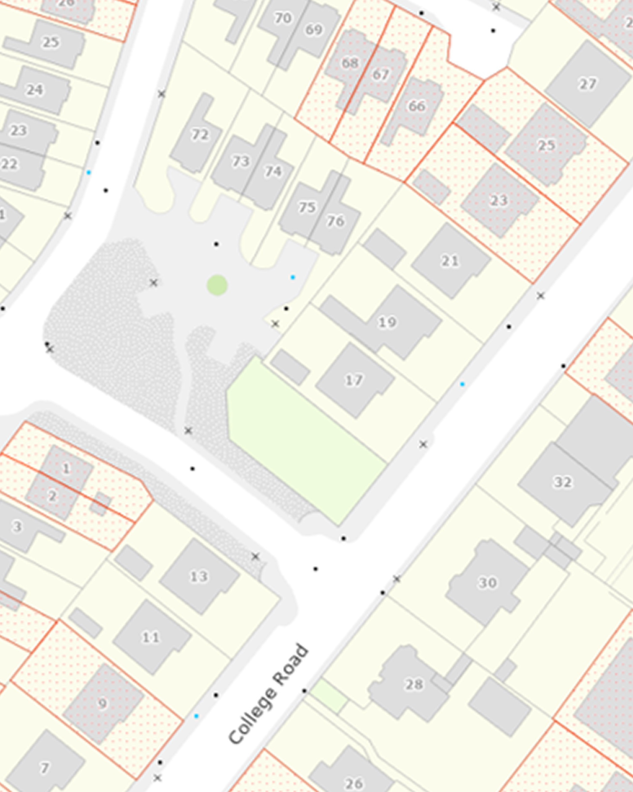 A detailed map showing a neighborhood layout with lots numbered from 1 to 76, streets, buildings, and property boundaries; some areas are shaded or marked with patterns, and there are small black dots and colored markers across the map.
