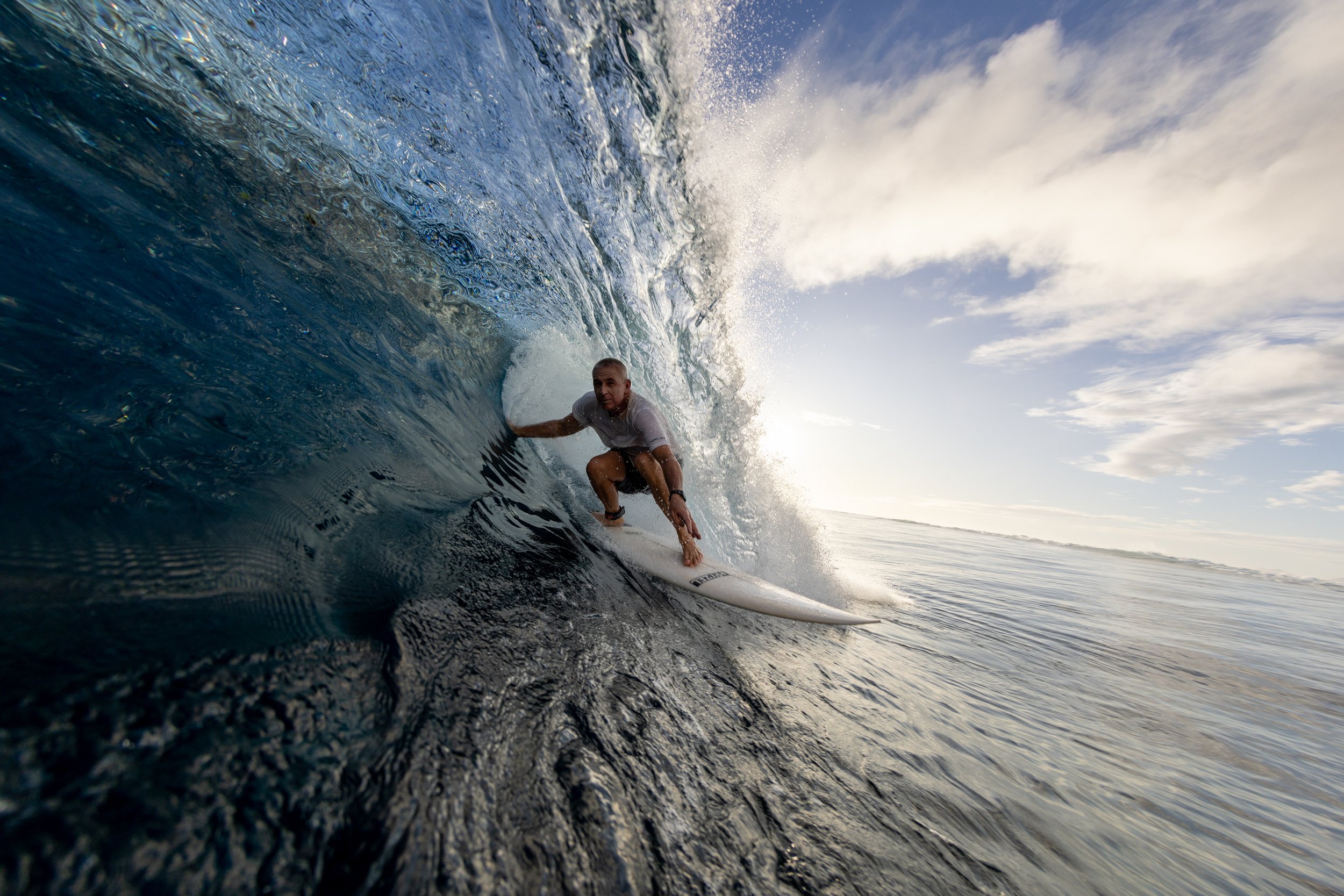 Professional surf instructor and coach Chris Prewitt getting barrelled on a wave in the tropics