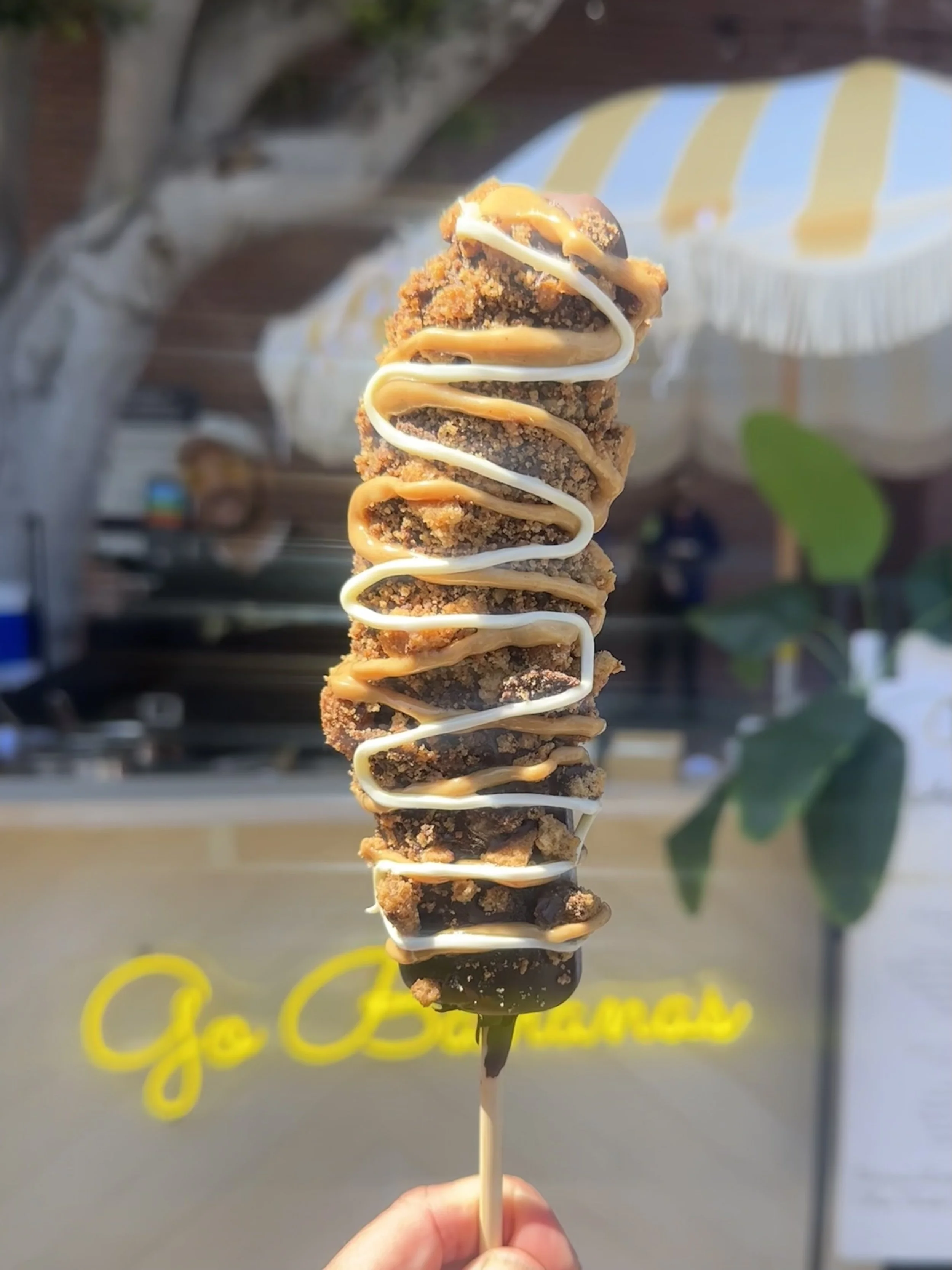 A chocolate dipped frozen banana with delicious toppings and drizzles. The best banana you'll ever have!