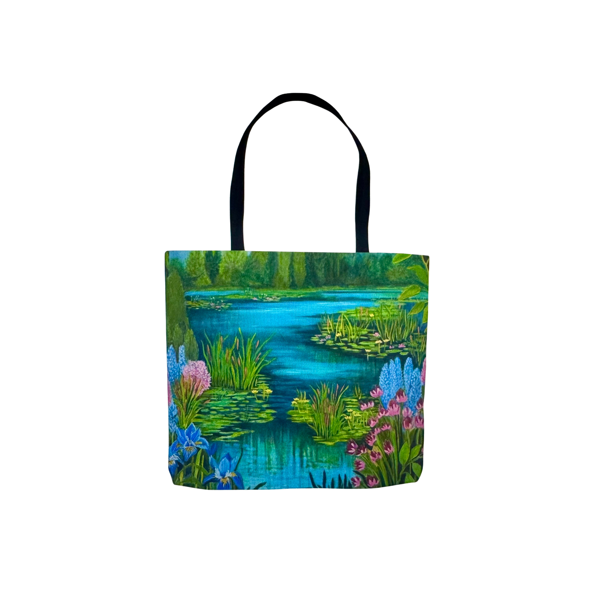 A colorful tote bags with a nature scene featuring water lilies and various flowers.