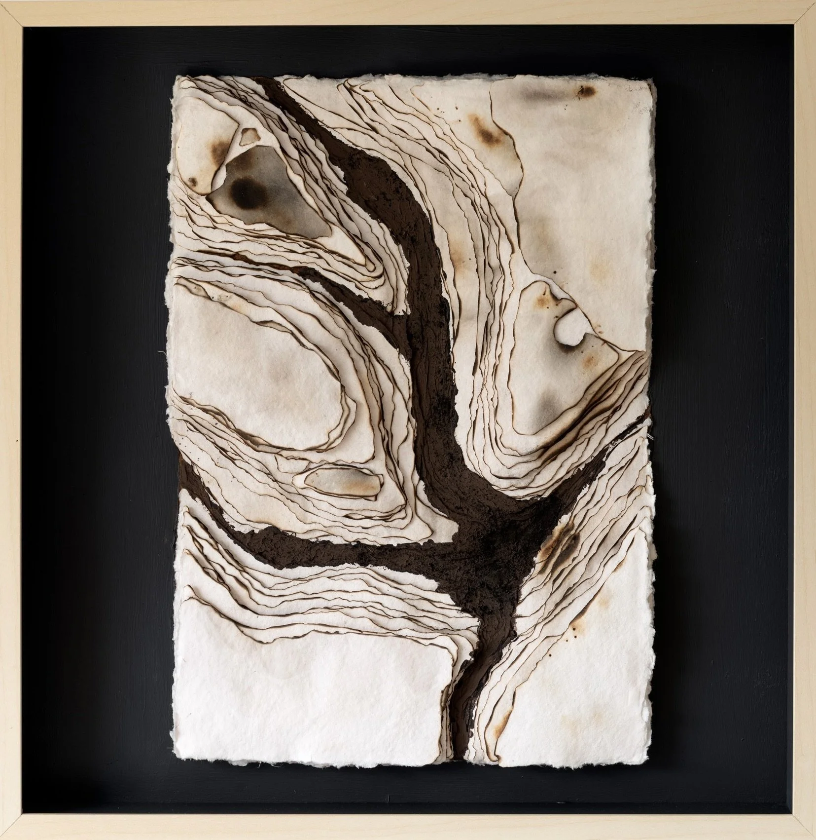 Trace, mixed-media artwork by Michelle Gow featuring layered cotton rag paper, burning and erosion.