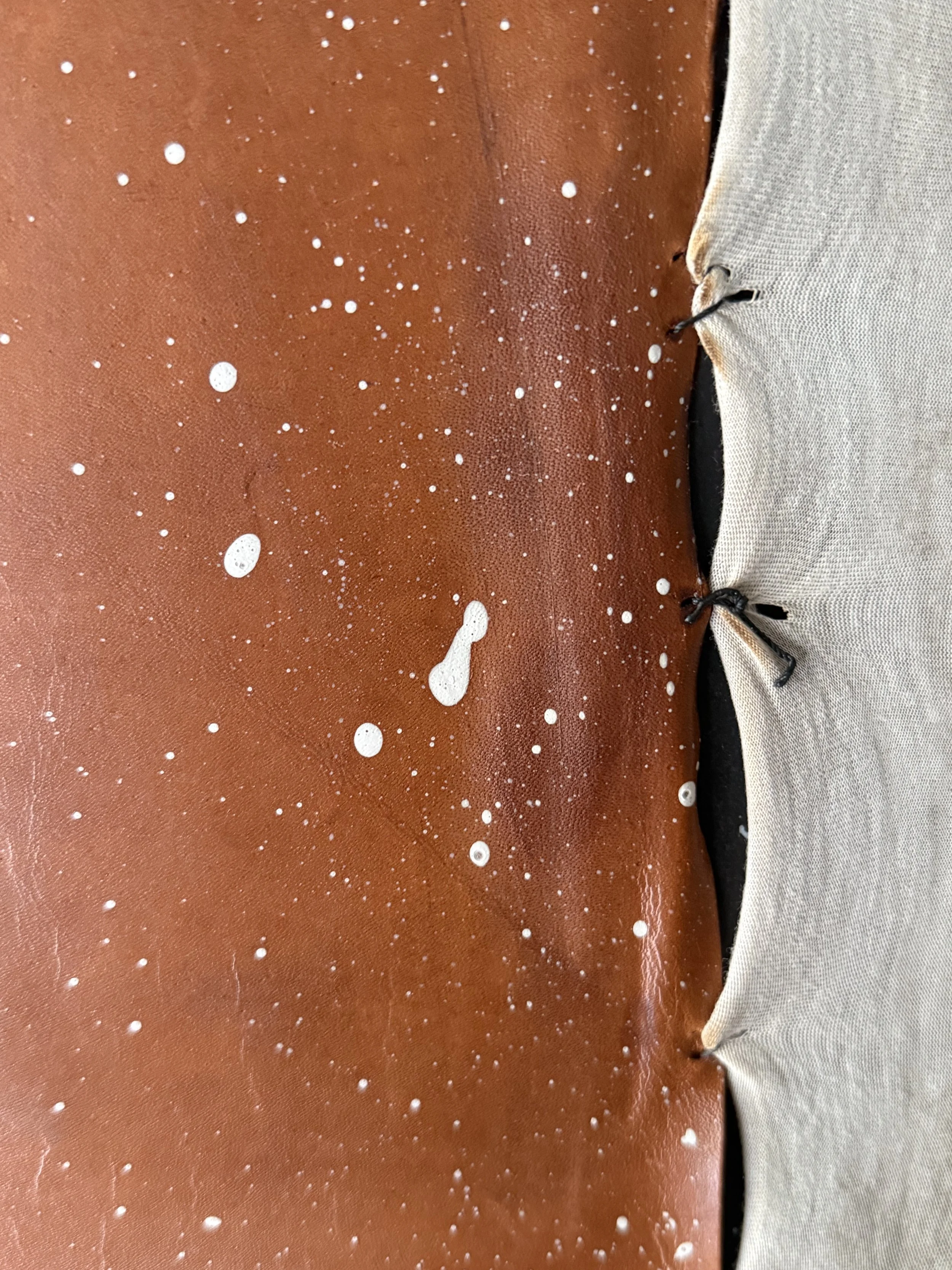 Surface detail from Thin Skin by Michelle Gow, revealing tension, fragility and wear.