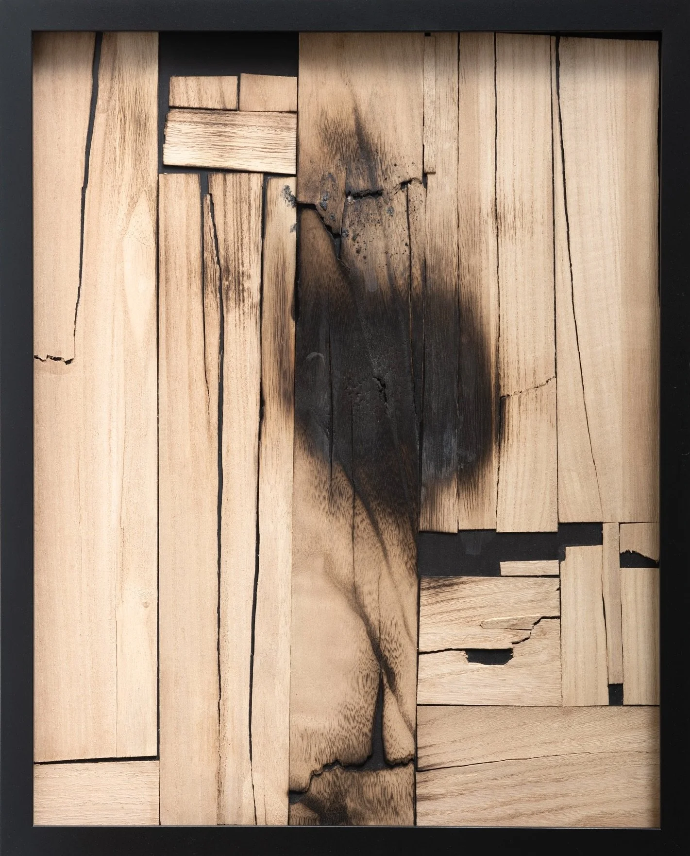 Fault, mixed-media artwork by Michelle Gow featuring charred timber and fractured surfaces