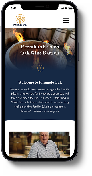 Mobile screen displaying Pinnacle Oak winery website with a logo, navigation menu, and a section about premium French oak wine barrels, including a photo of a man.