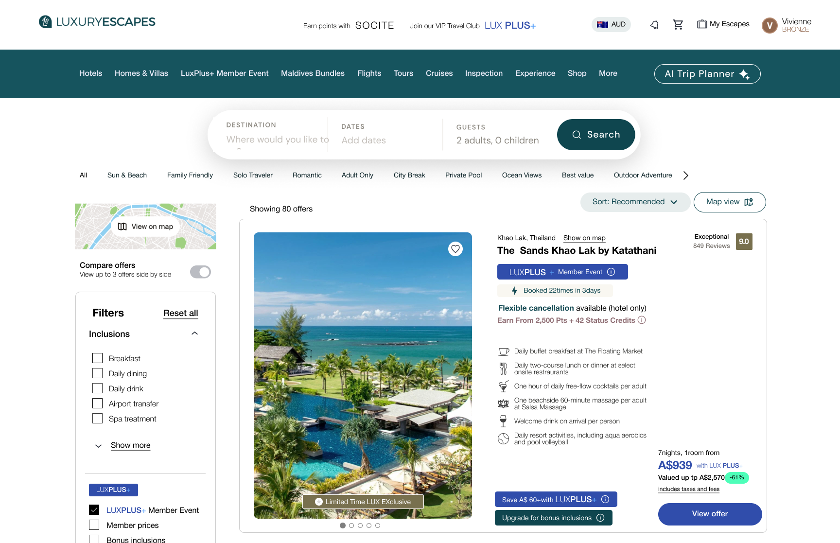 Travel booking website showcasing a tropical resort with a pool, palm trees, and the ocean in the background in Khao Lak, Thailand.