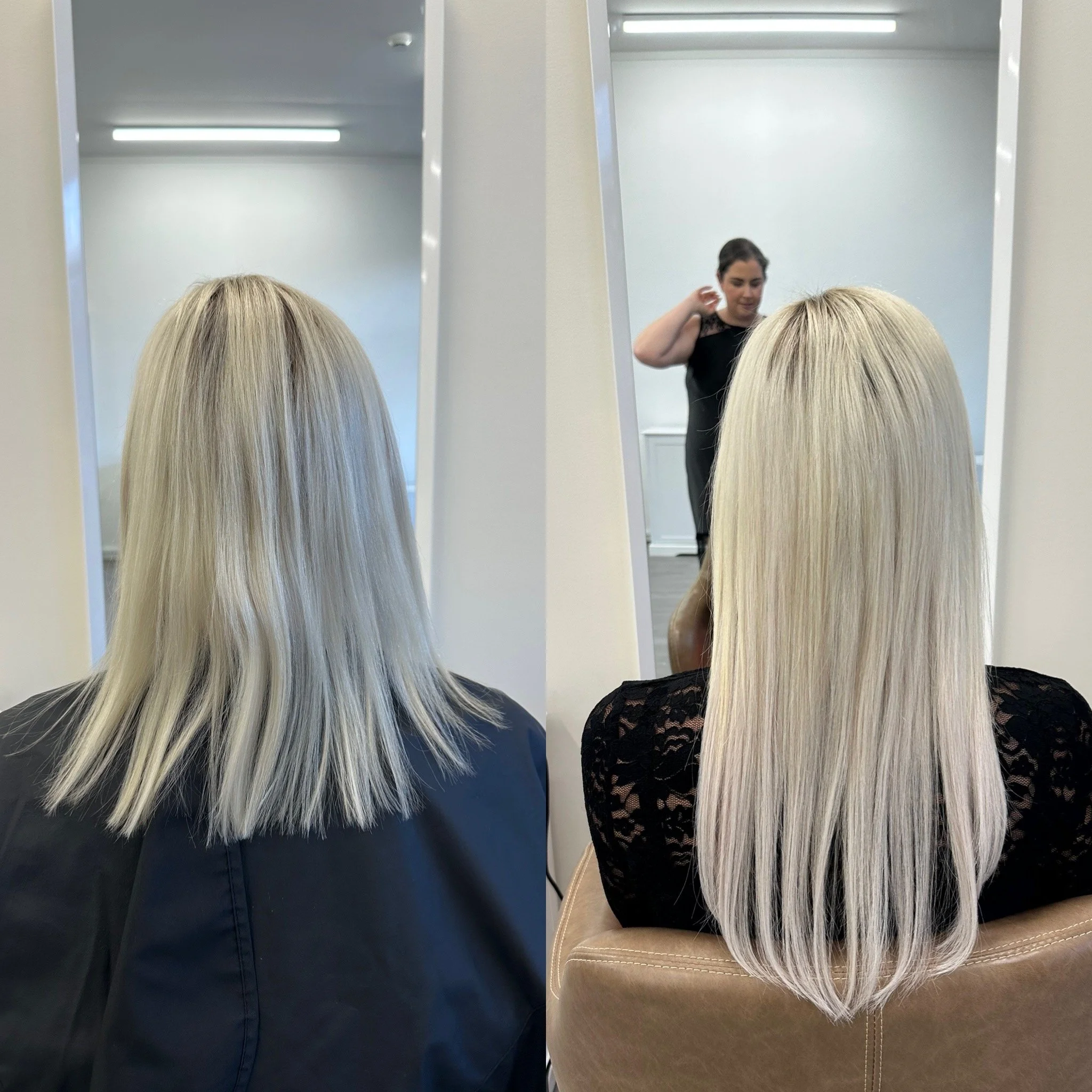 Two women with long blonde hair, one wearing a black lace top and the other a black shirt, viewing themselves in standing mirrors at a salon or similar setting.