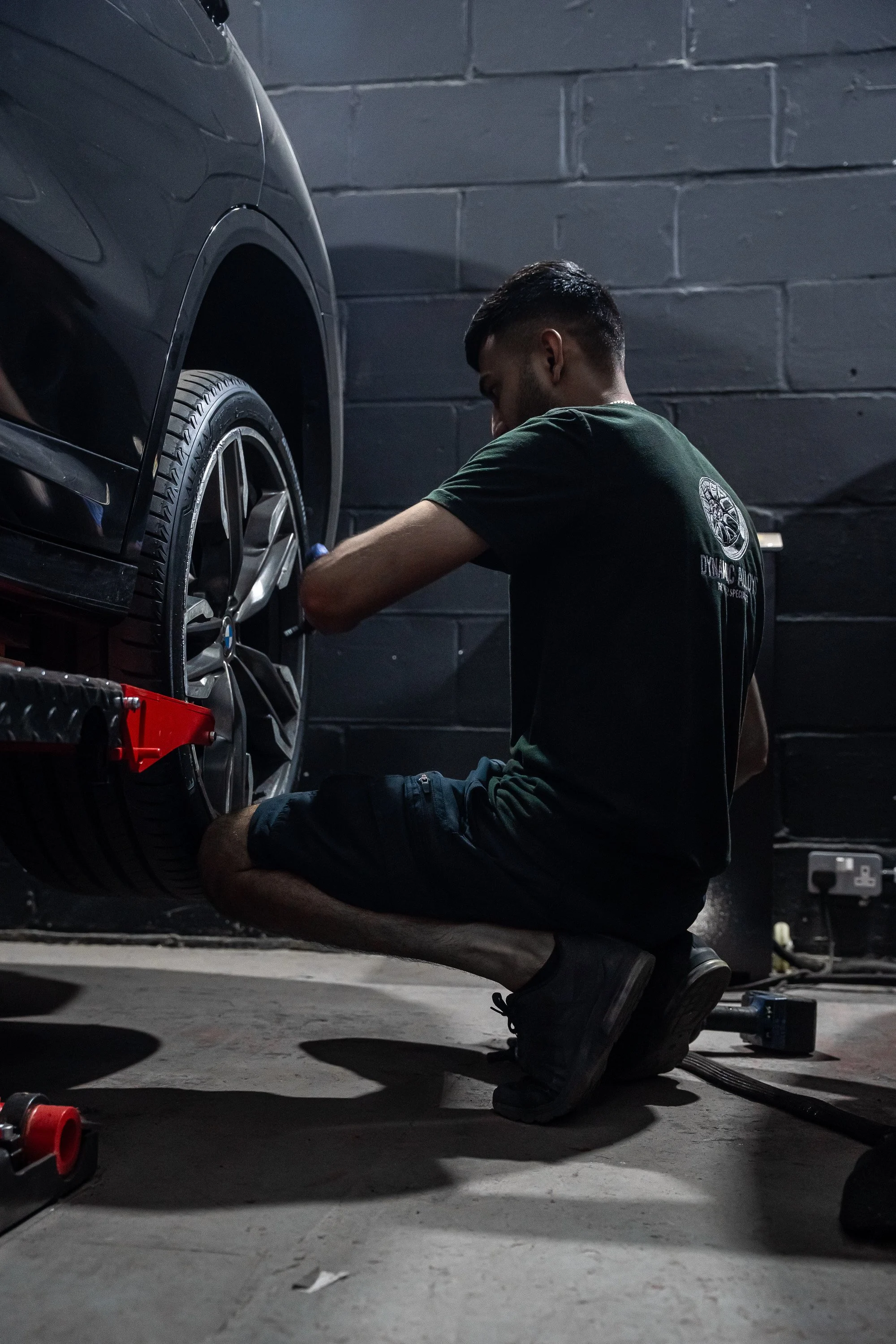 Man repairing damaged alloy