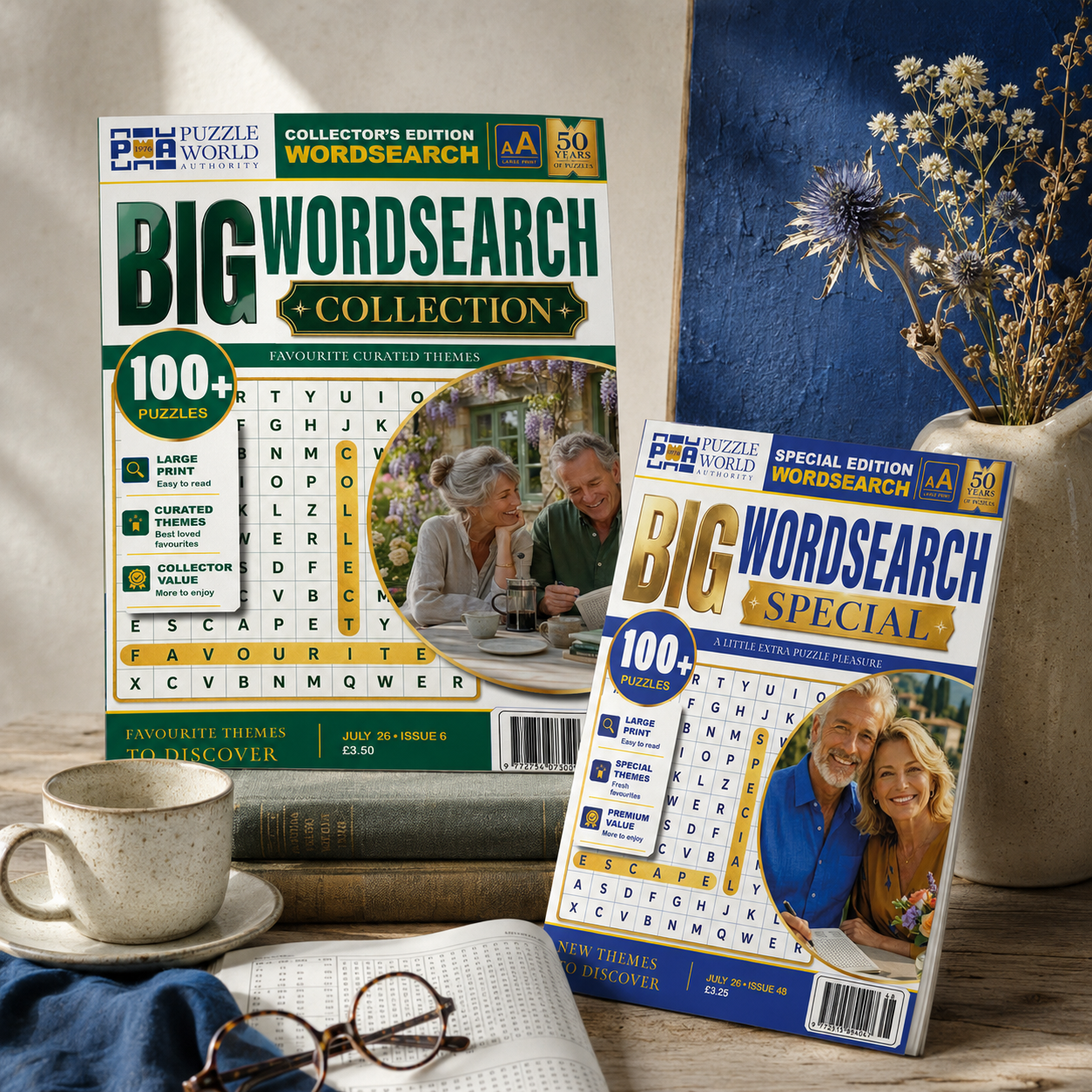 Two large puzzle booklets titled "Big Wordsearch Collection" and "Big Wordsearch Special" sitting on a table next to a cup, open book, and glasses. The background includes a vase with flowers and a textured blue wall.