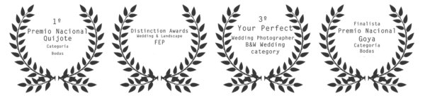 Four laurel wreaths with inspirational quotes inside meant for award or recognition purposes.