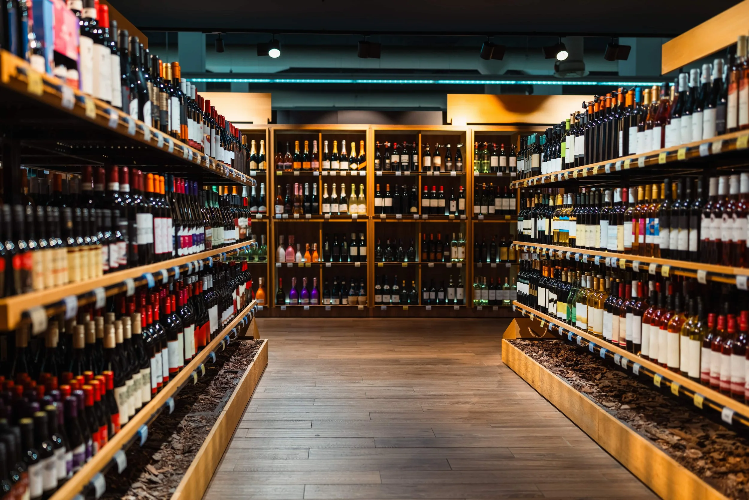Liquor store or bottle shop storefront with glass frontage and high-value stock vulnerable to break-ins