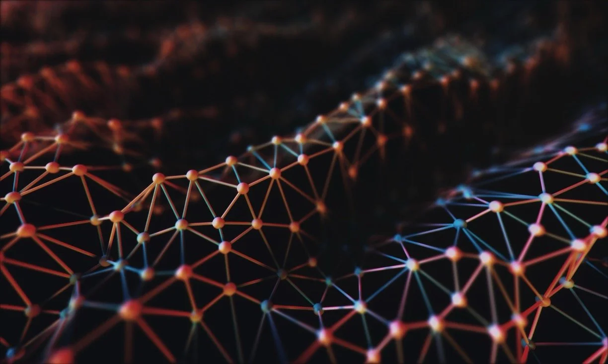 Close-up of a digital network grid with interconnected points and lines, displaying a 3D web of nodes in vibrant colors.