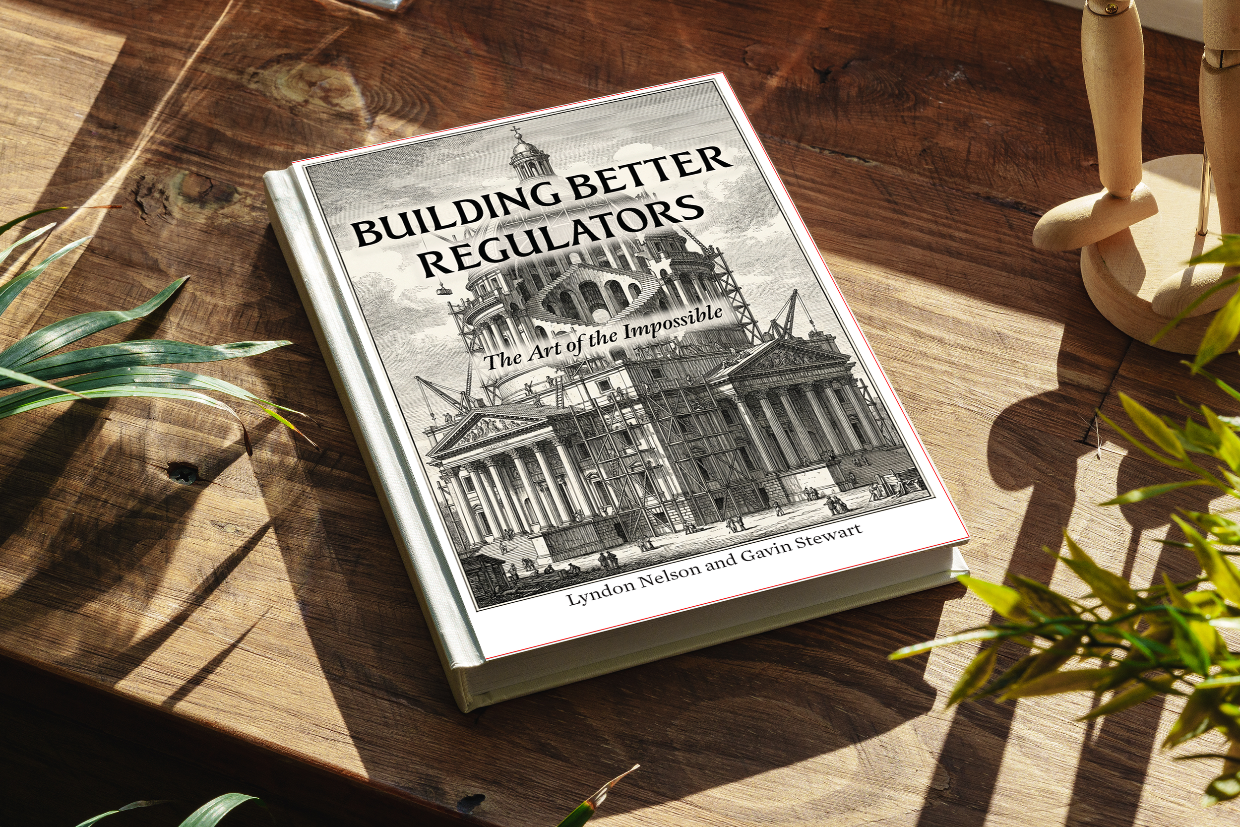 A book titled "Building Better Regulators: The Art of the Impossible" resting on a wooden table. The cover features a detailed black-and-white architectural drawing of a large building under construction.