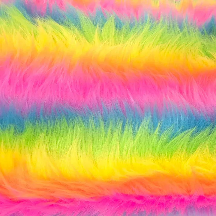 Close-up of rainbow-colored faux fur fabric with vibrant pink, yellow, green, and blue hues.