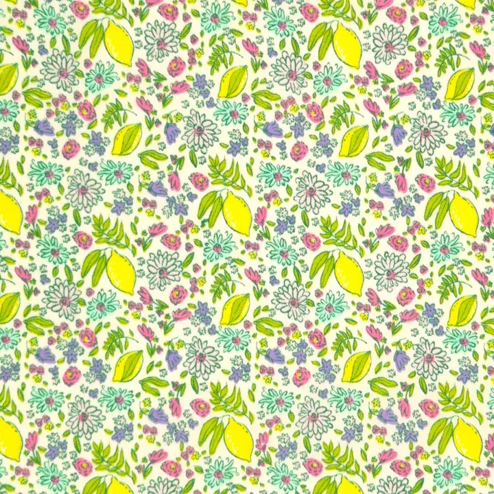 A colorful floral pattern with lemons, daisies, lilacs, and pink flowers on a light background.