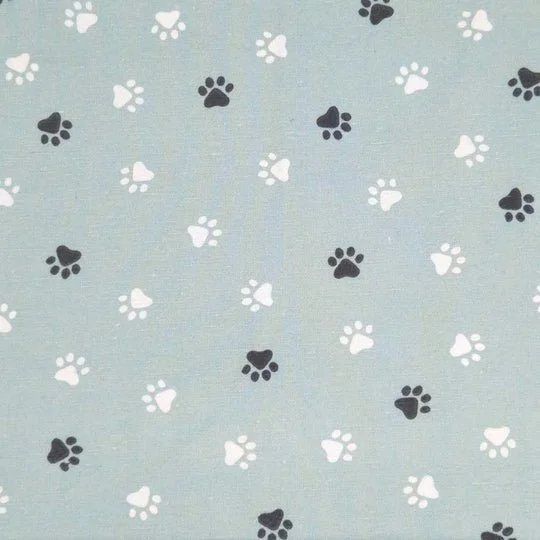 Light blue background with scattered black and white paw prints.