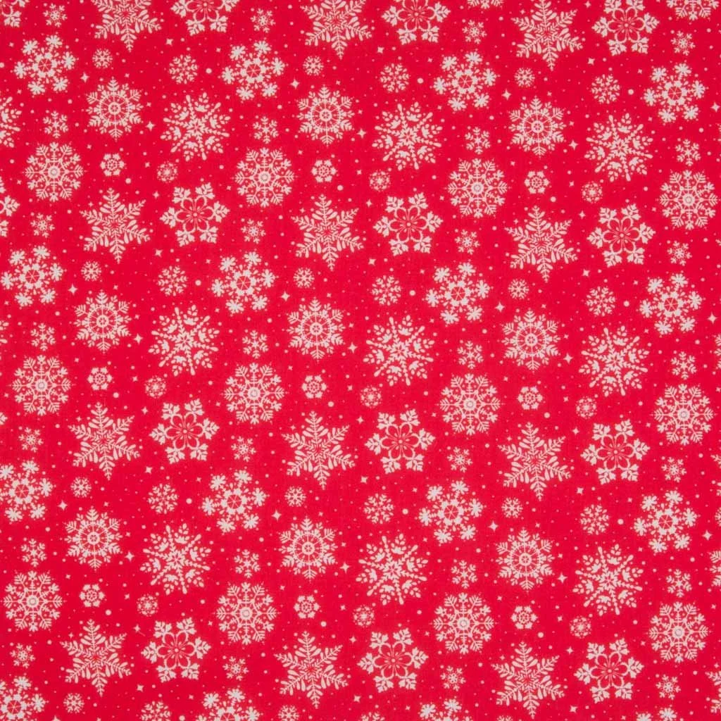 Pattern of white snowflakes on a red background, with various snowflake designs and small dots