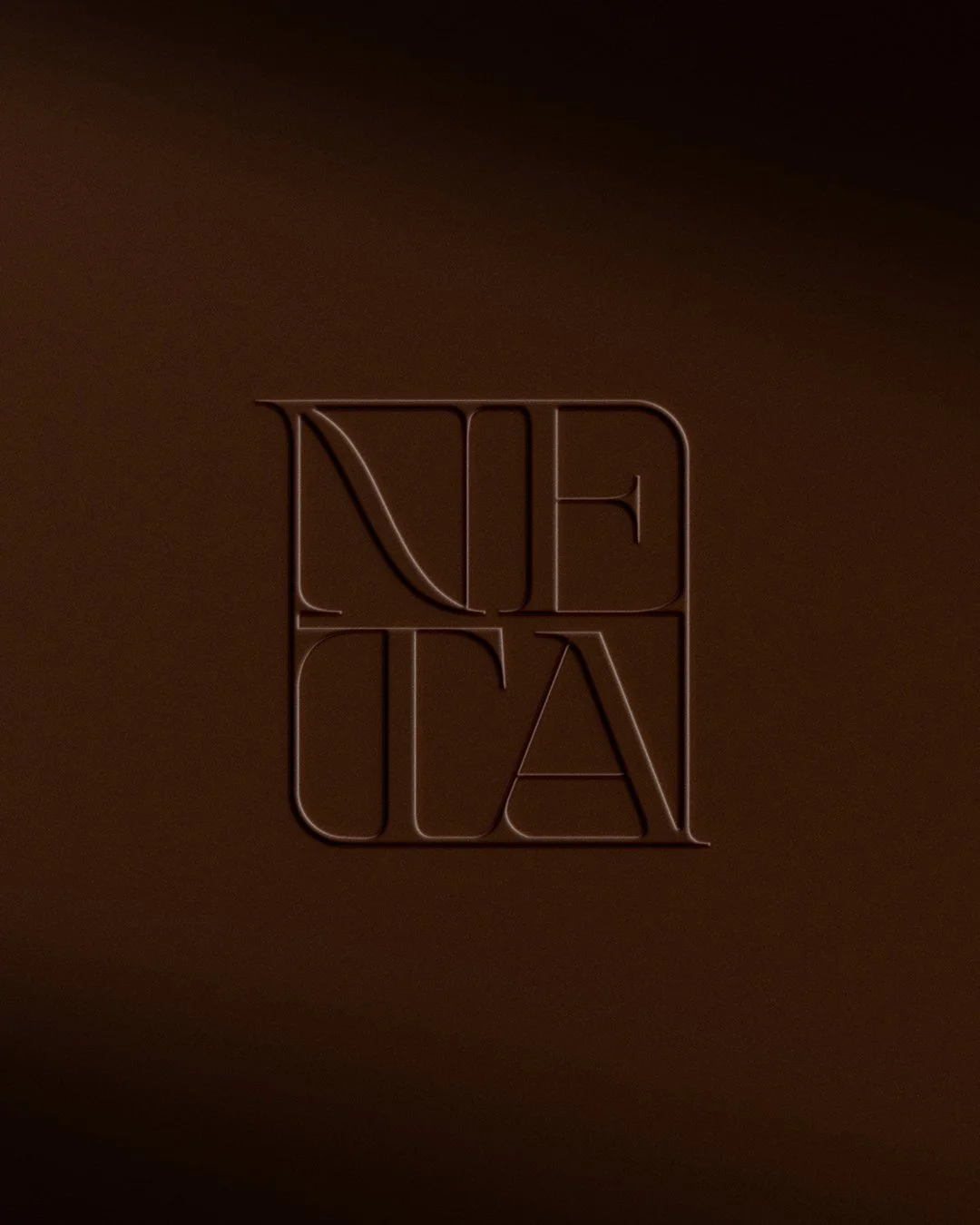 Dark background with a minimalist, embosed logo in the center that reads "NETA" with the letter "N" and "A" stylized.